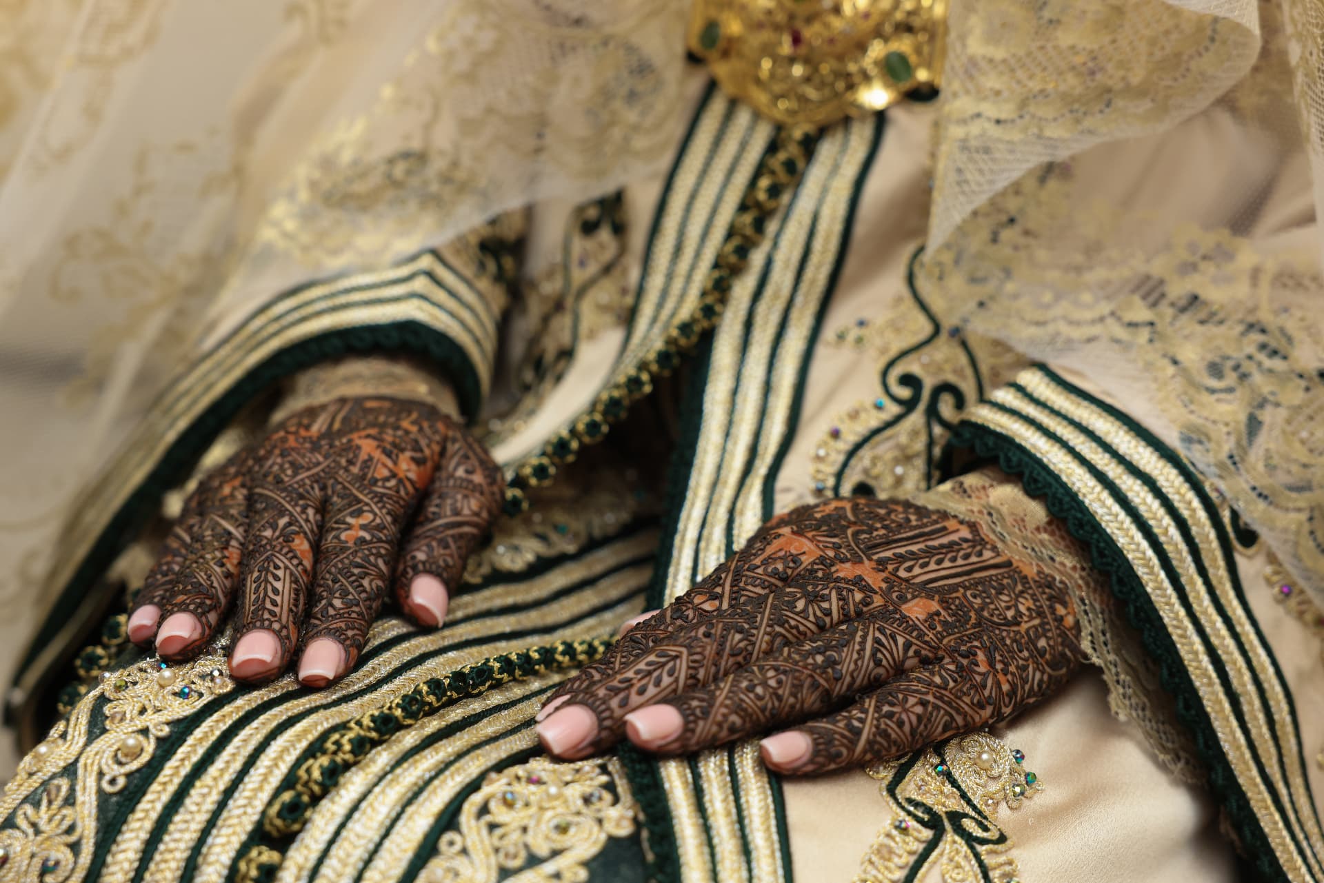 Henna and rings with cream and green embroidered fabric