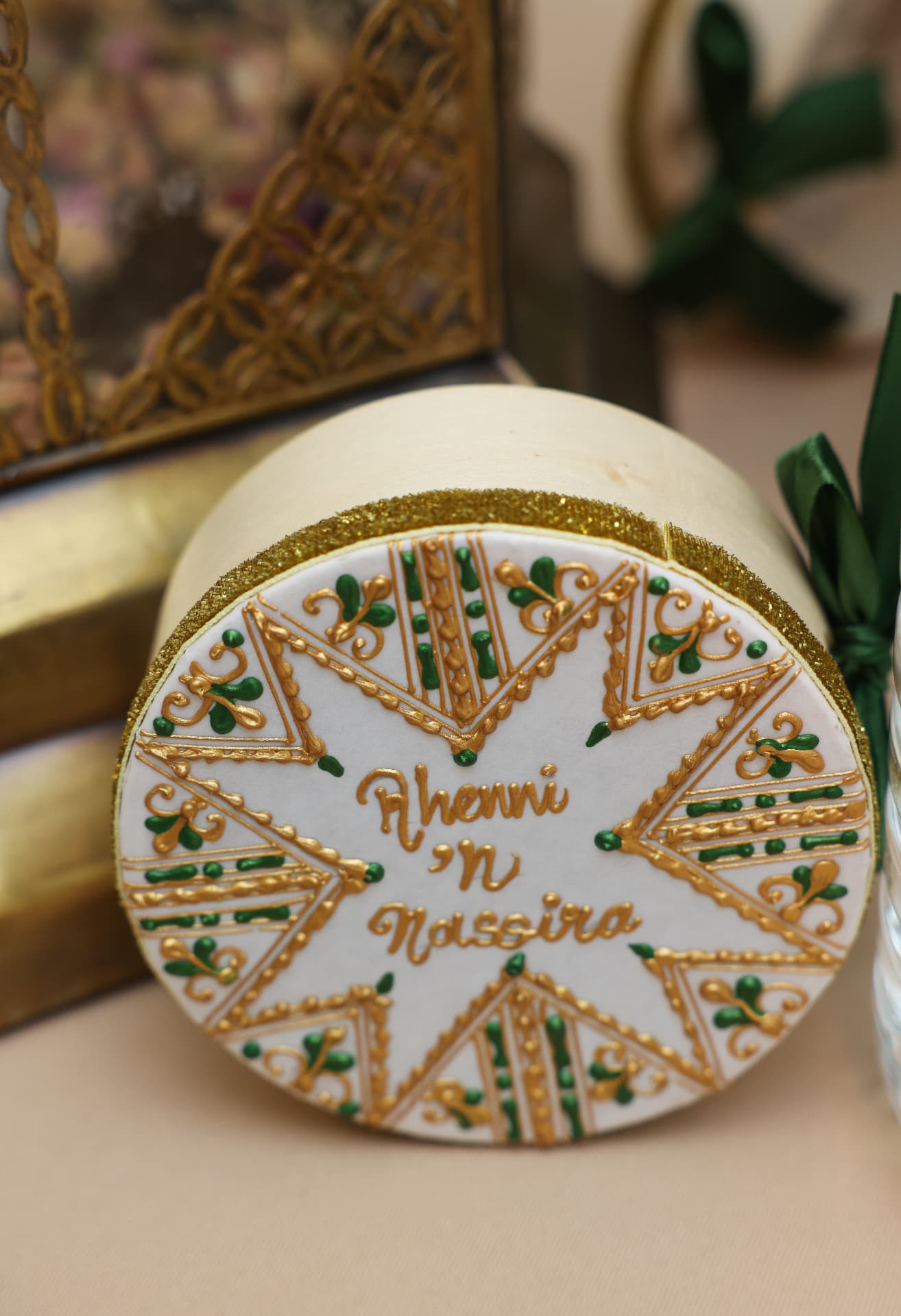 Hand-decorated celebration plate with green and gold details